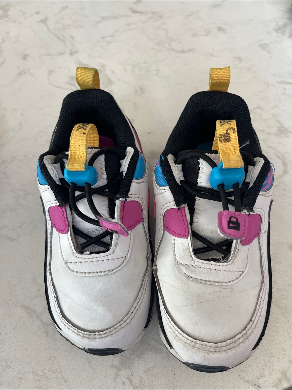 Nike White Kids Sneakers with Pink, Blue & Yellow Accents